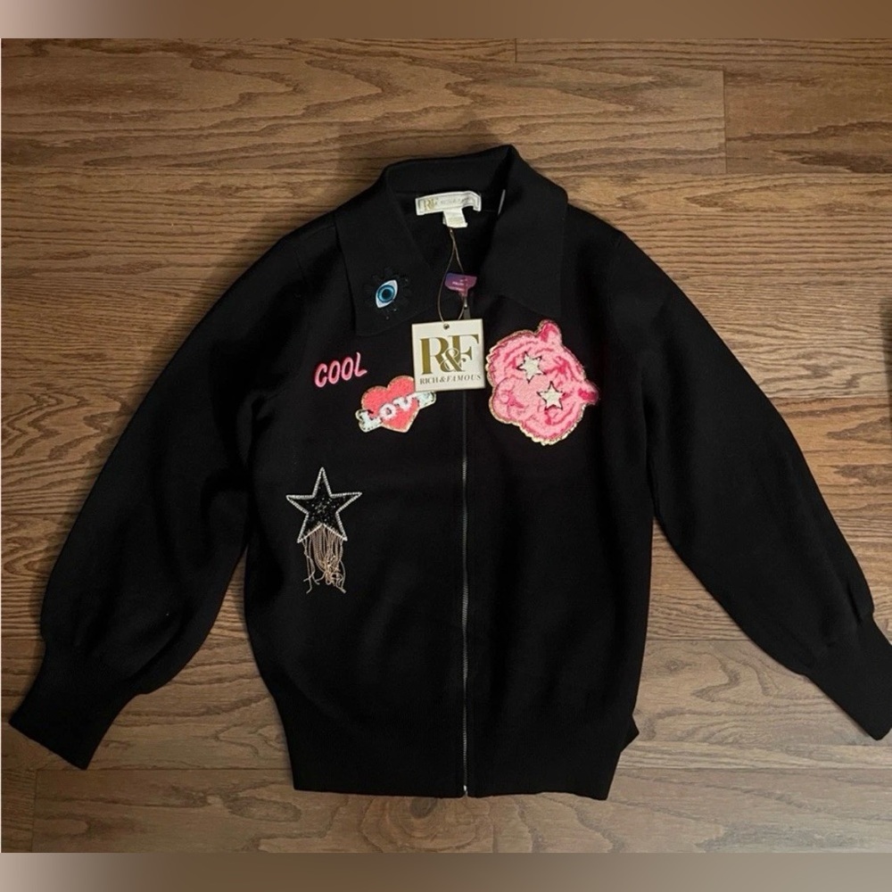 NWT Rich and famous Black Zip-Up sweater w/ Pink and White cool design Patches M